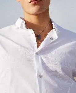 Chemise en coton blanc avec boutons métal